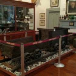 Wooden coal cars and track are on display in the Christian-Davis Room. They were found in 1978 inside a small abandoned coal mine that was probably active during the Civil War. Tools such as picks and hammers that were also found at the same location are on display.