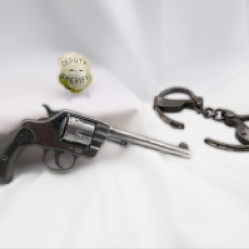 Pistol, Handcuffs and Badge